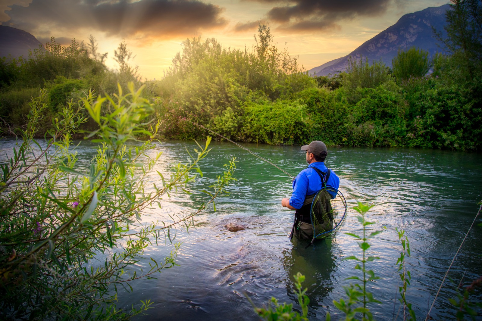 a man fly-fishing nymph technique in a river